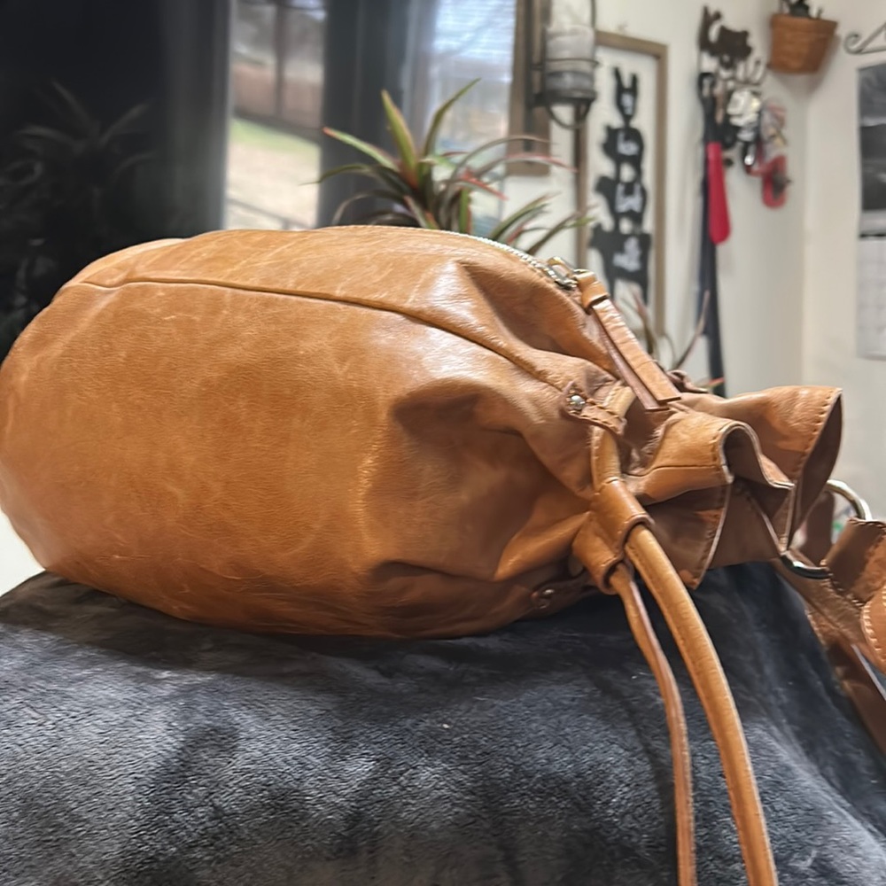 Hobo tan leather backpack sling with draw string closure or zipper
